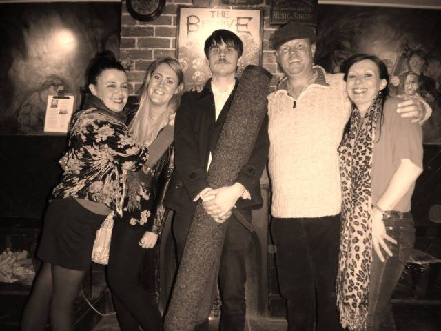 Here is Alex looking joyous under The Sacred Beehive picture with the Sacred Drum Carpet